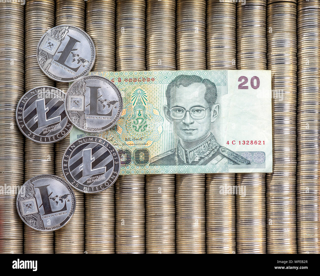 Silver crypto coins Litecoin LTC, paper notes Thai baht. Metal coins are  laid out in a flat background, close-up view from the top, crypto currency  ex Stock Photo - Alamy