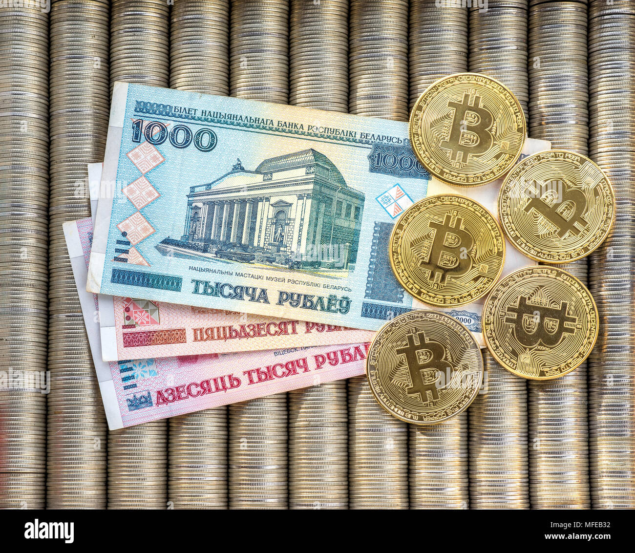 Gold crypto coins bitcoin BTC, paper Belarusian ruble. Metal coins are laid  out in a flat background, close-up view from the top, crypto currency exch  Stock Photo - Alamy