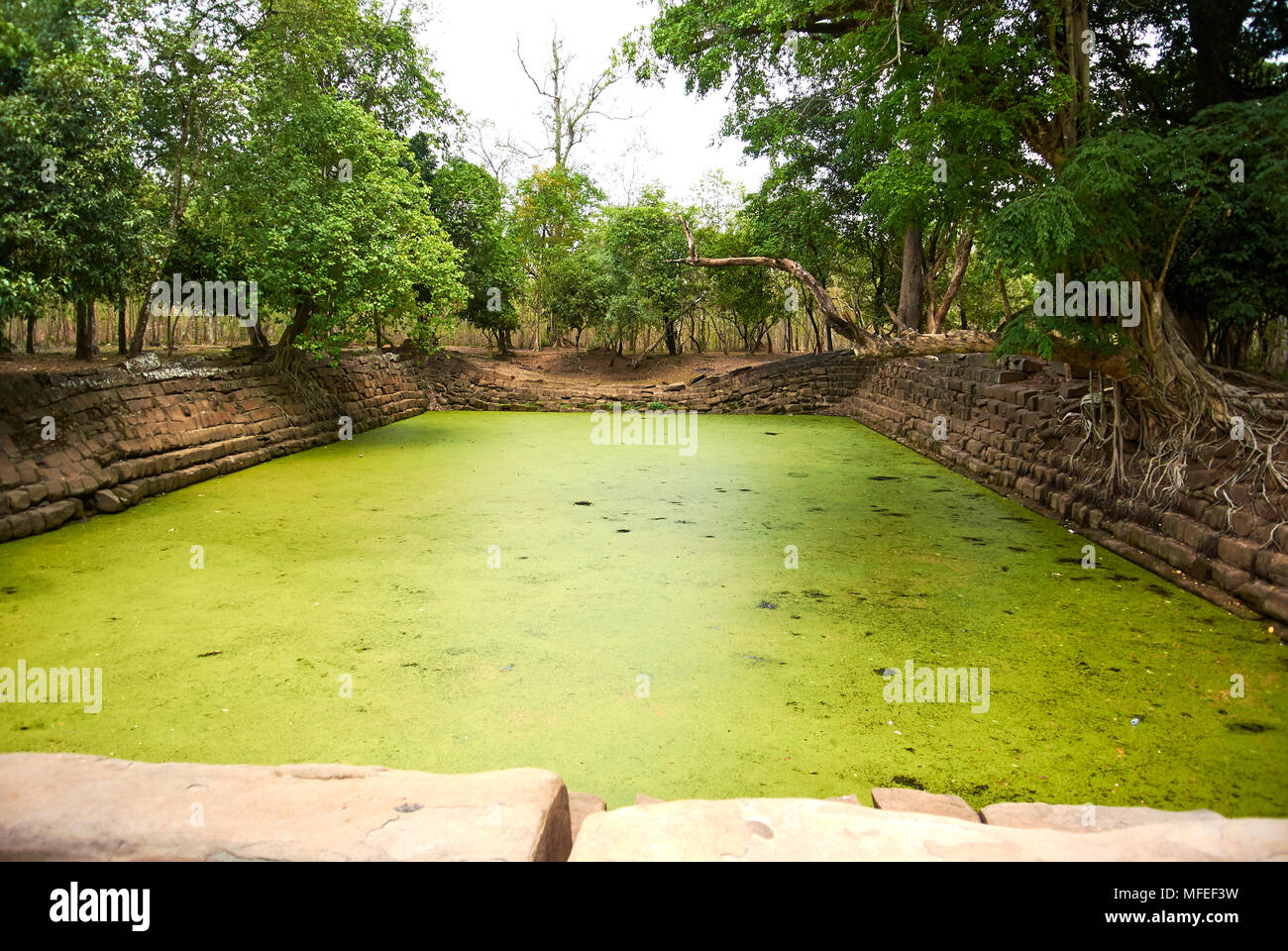 200 m (219 yd) south of the double-sanctuary Prasat Thom/Prang is a basin dug into the earth with a length of 40 m (44 yd). It has steps of laterite o Stock Photo