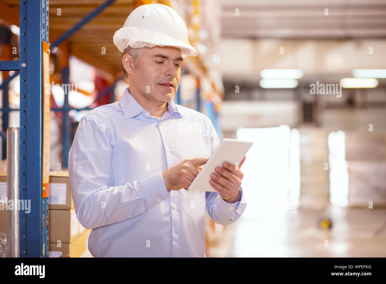 Smart nice businessman using a tablet Stock Photo