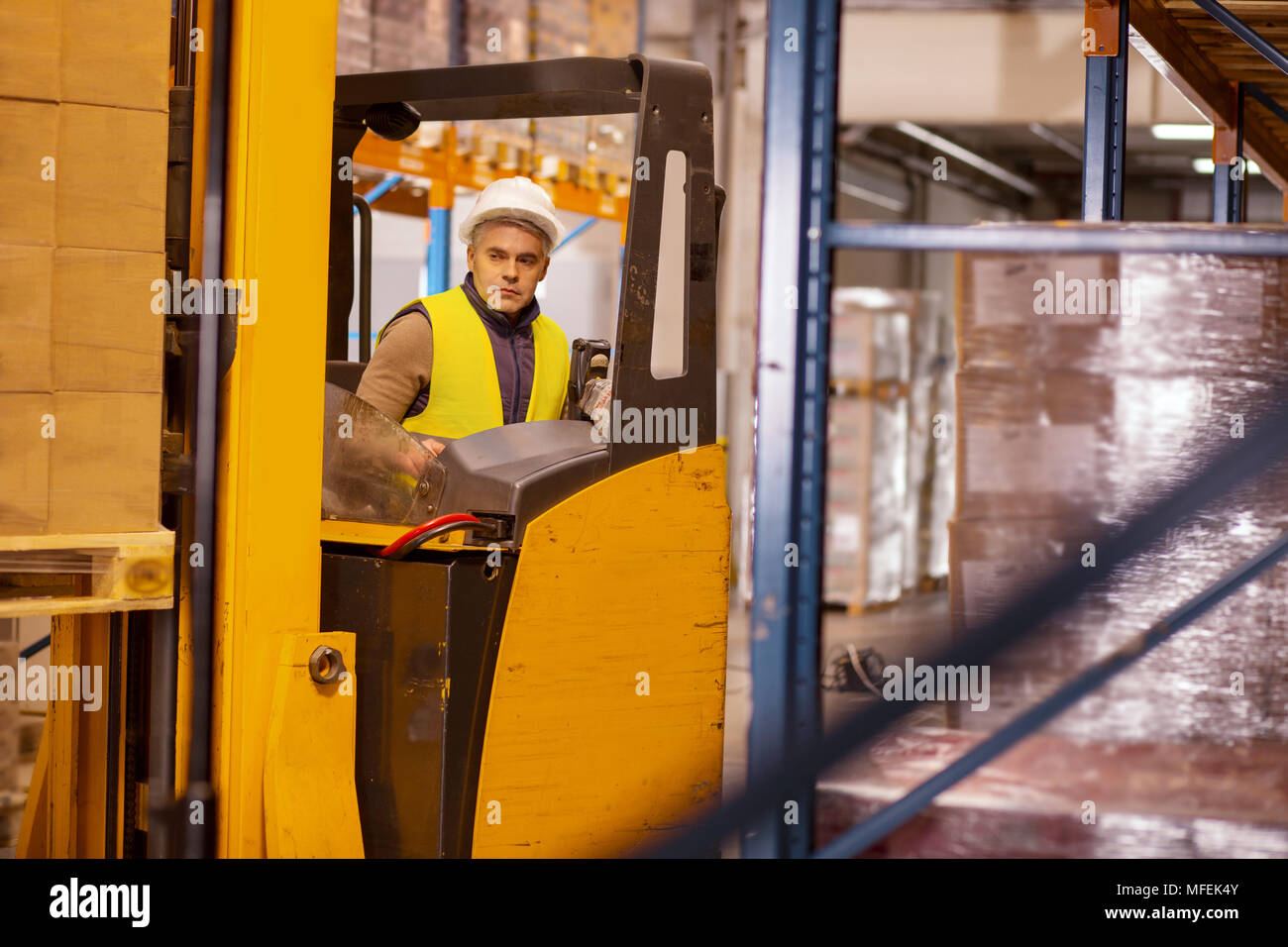 Serious machine operator doing his job Stock Photo