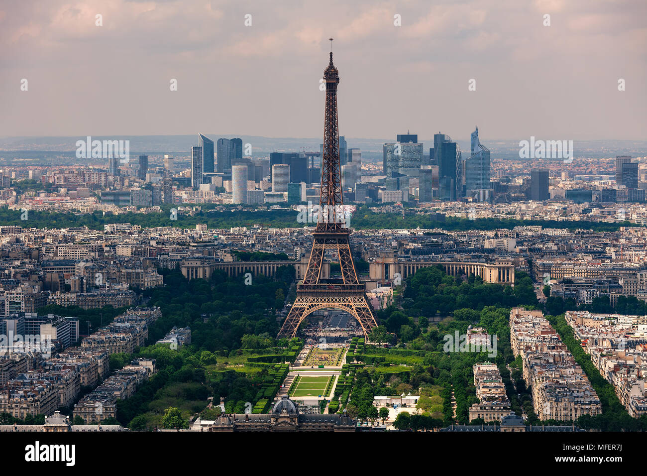 Aerial view of Eiffel Tower, Champ de Mars and La Defense district on background as seen from Montparnasse Tower in Paris, France. Stock Photo