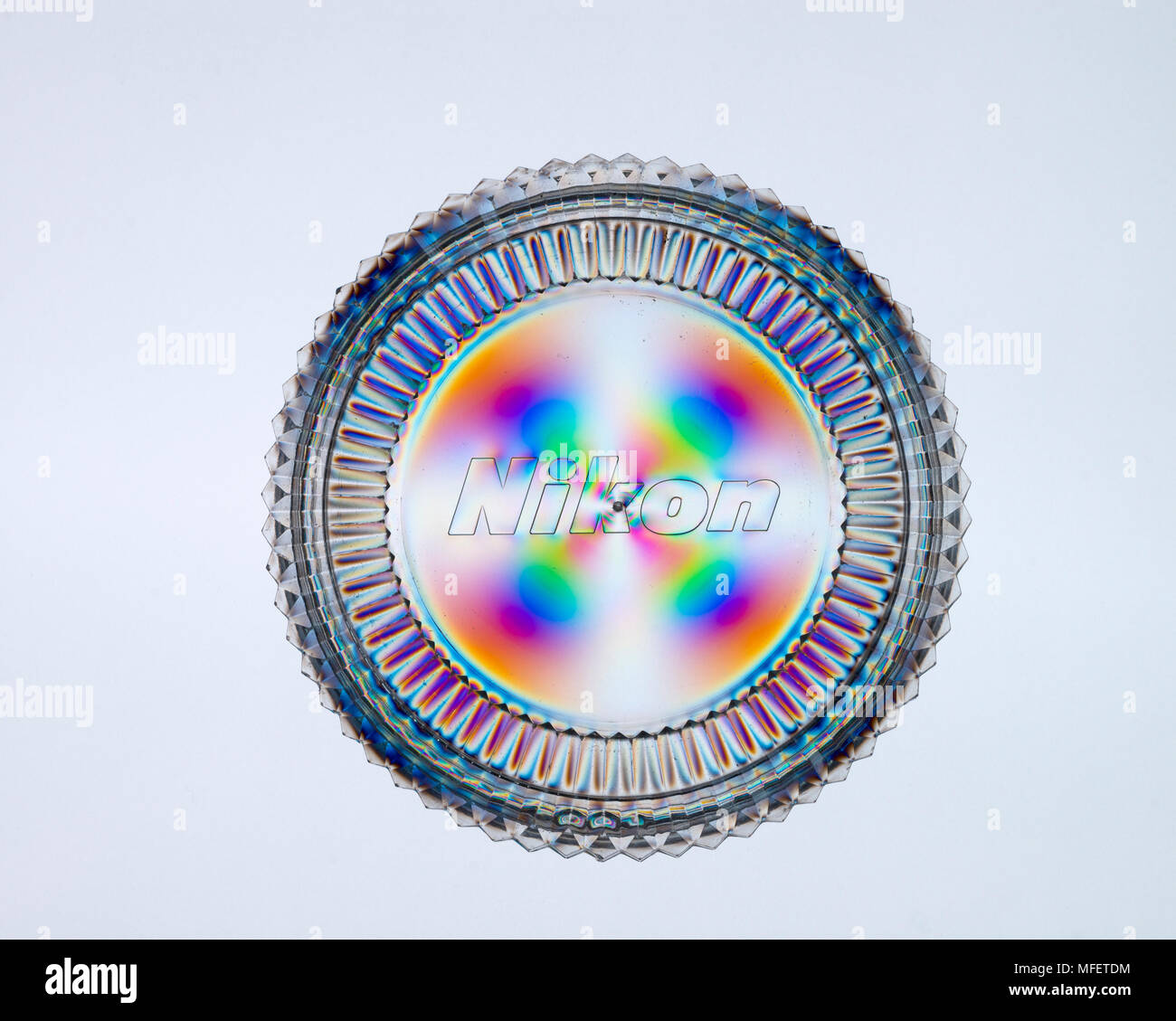 Cross polarization showing stress within plastic filter case Stock
