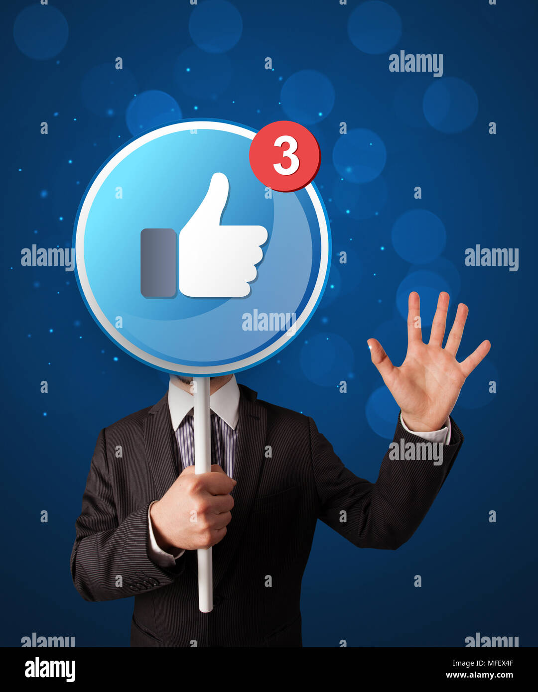 Smart businessman holding round sign with facebook like Stock Photo Alamy
