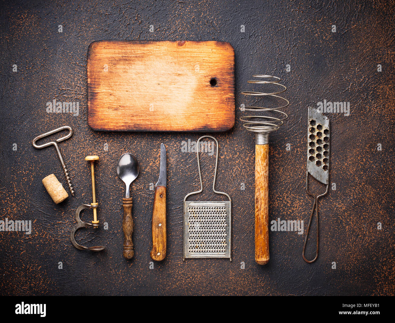 Old vintage kitchen utensils on rusty background Stock Photo Alamy