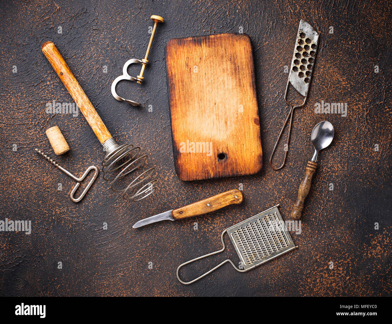 Old vintage kitchen utensils on rusty background Stock Photo - Alamy