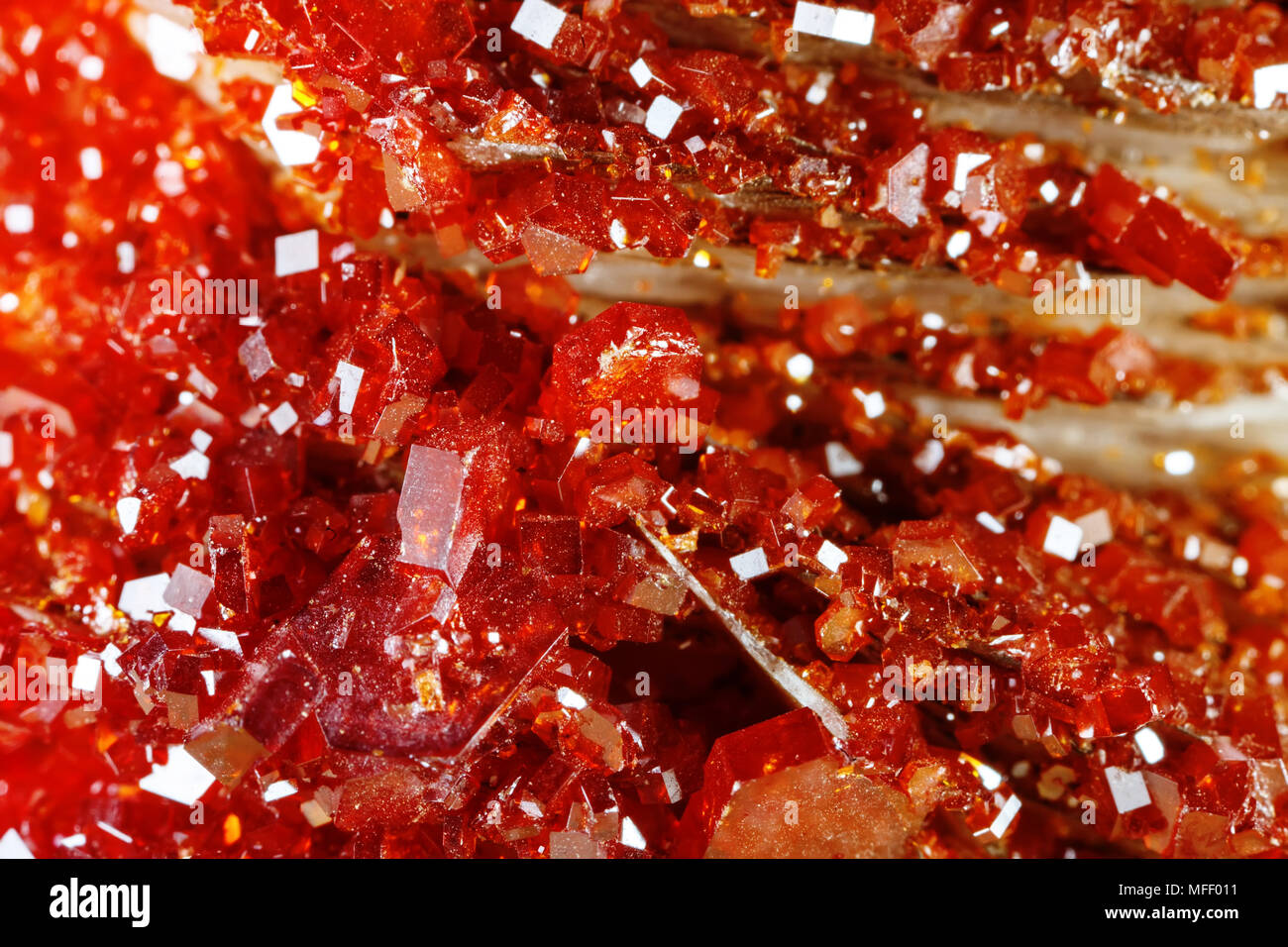 Macro shooting of natural gemstone. Texture of mineral vanadinite. Abstract background. Stock Photo