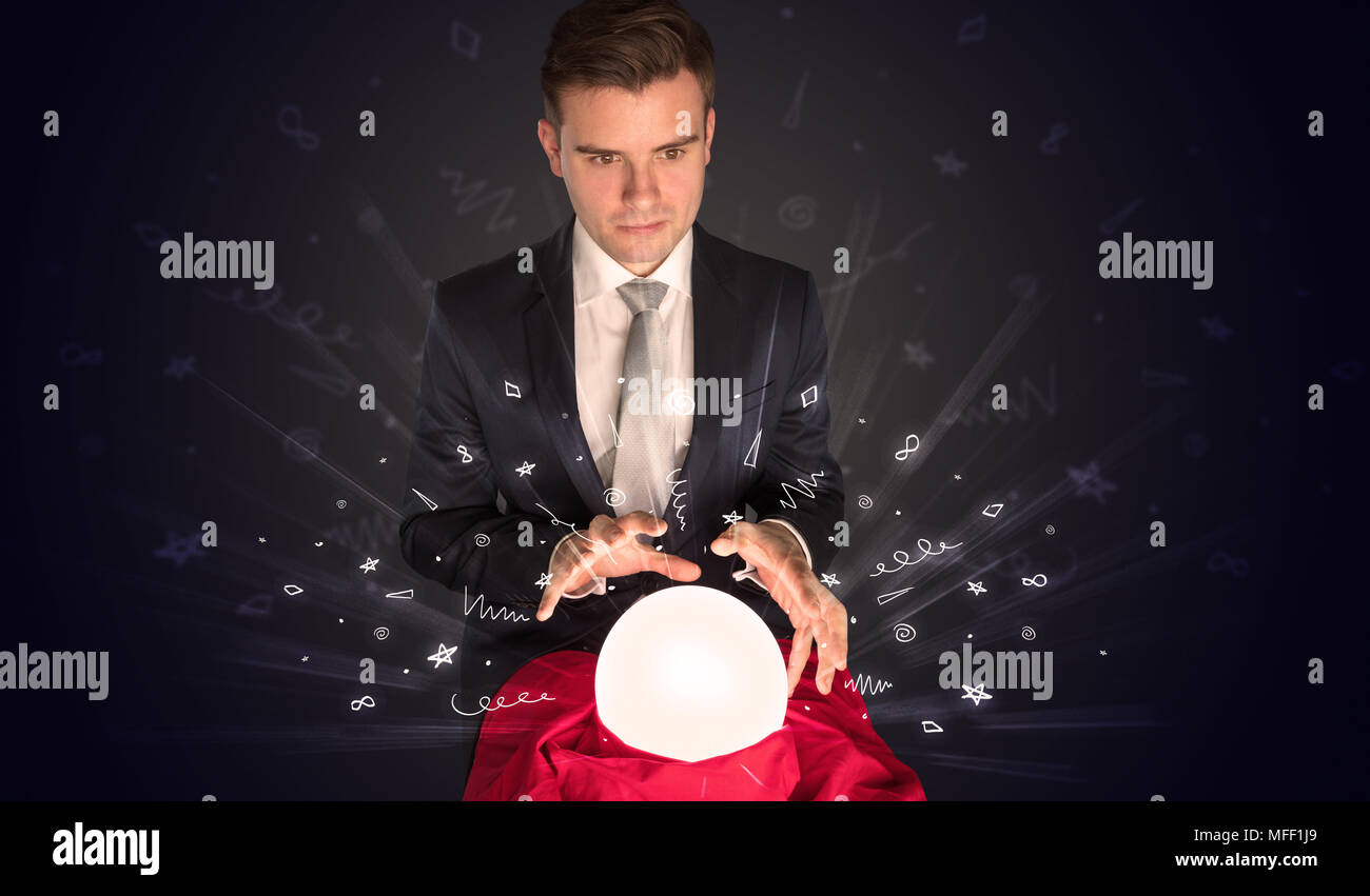 Businessman looking into crystal ball hi-res stock photography and ...