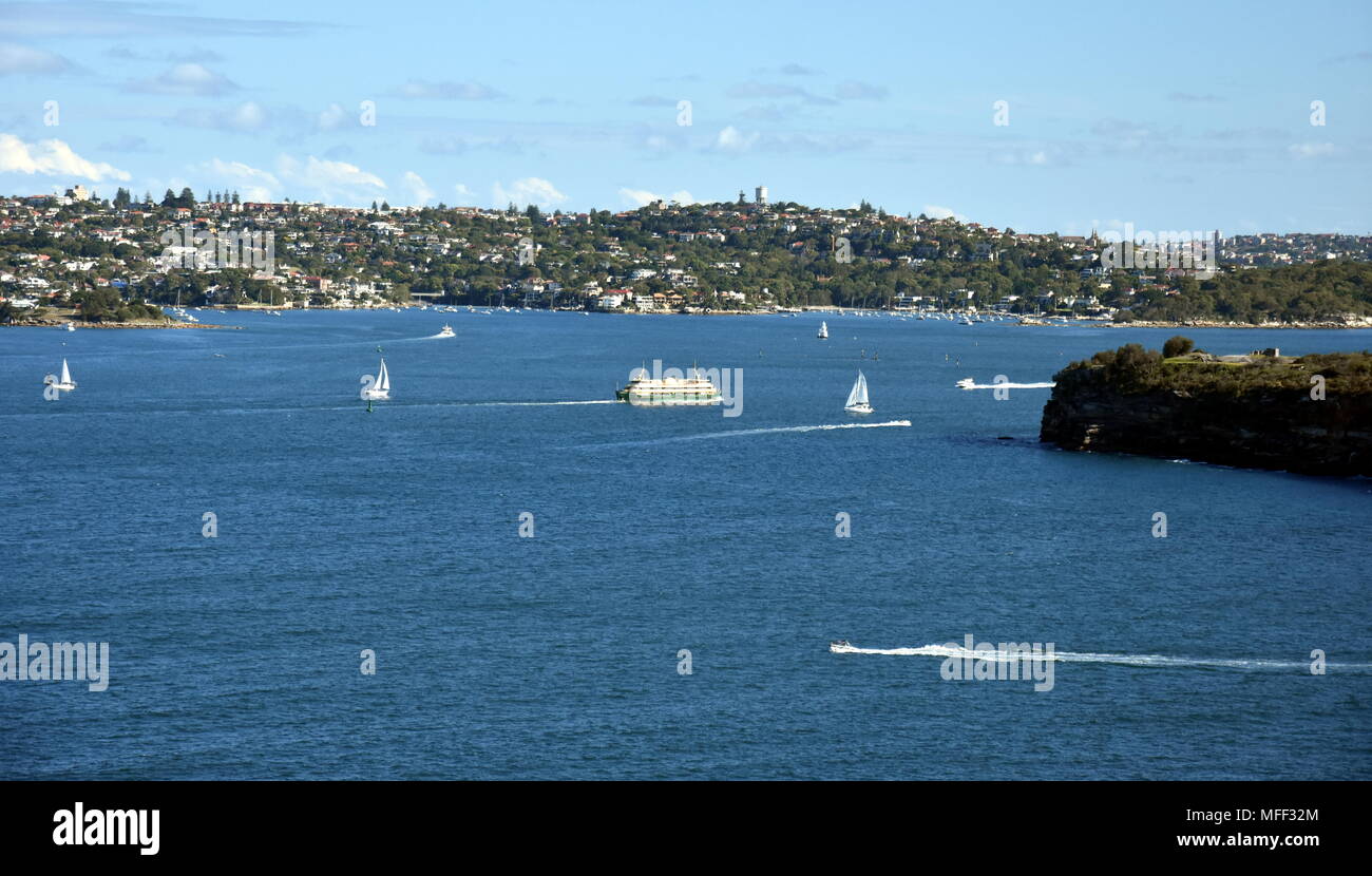 Manly ferry is turning into North Harbour to Manly wharf. South Head and Watsons bay view from
