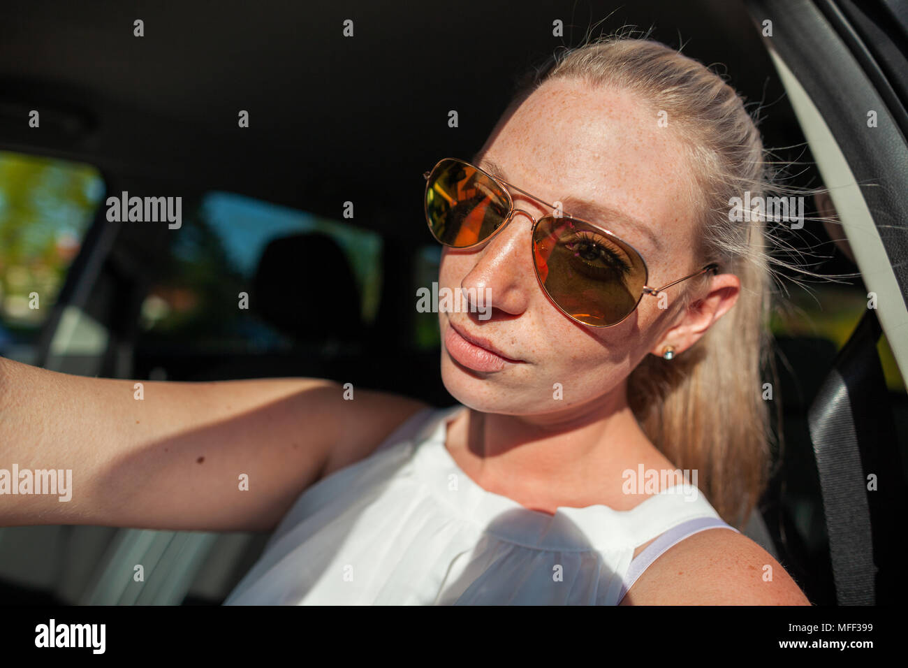 young woman with sunglasses in a car Stock Photo - Alamy
