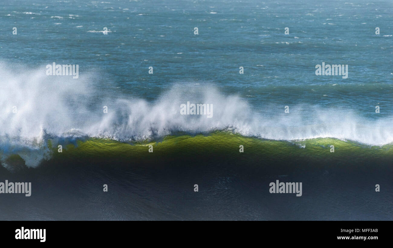 A large wave breaking at Fistral in Newquay in Cornwall. Stock Photo