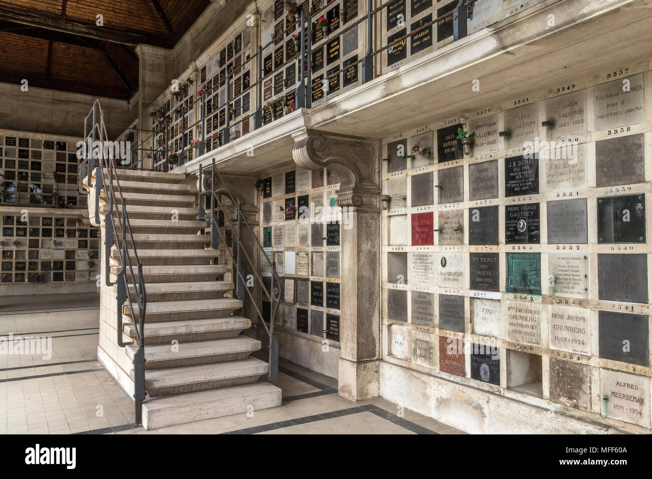 Plaques on the wall of the crematorium / Columbarium in Pere Lachaise cemetery in Paris ,France Stock Photo