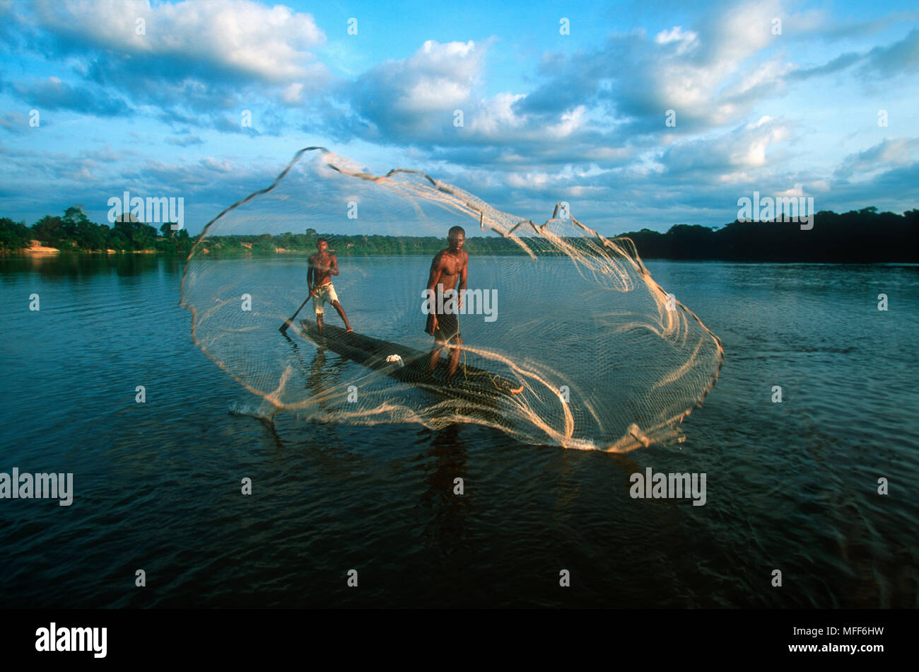 FISHERMAN CASTING NET in the Dzanga River, Central African Republic. Stock Photo