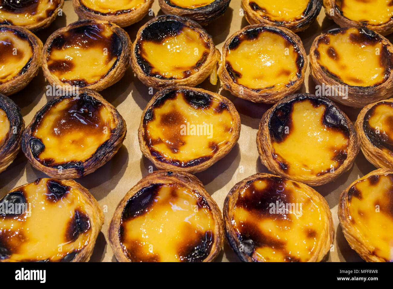 Traditional portuguese pastry - pastel de nata in a bakery in Porto, Portugal Stock Photo