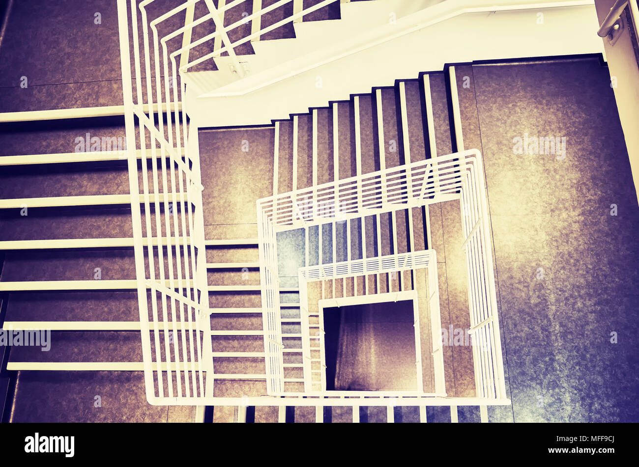Looking down at a modern staircase, color toned picture. Stock Photo