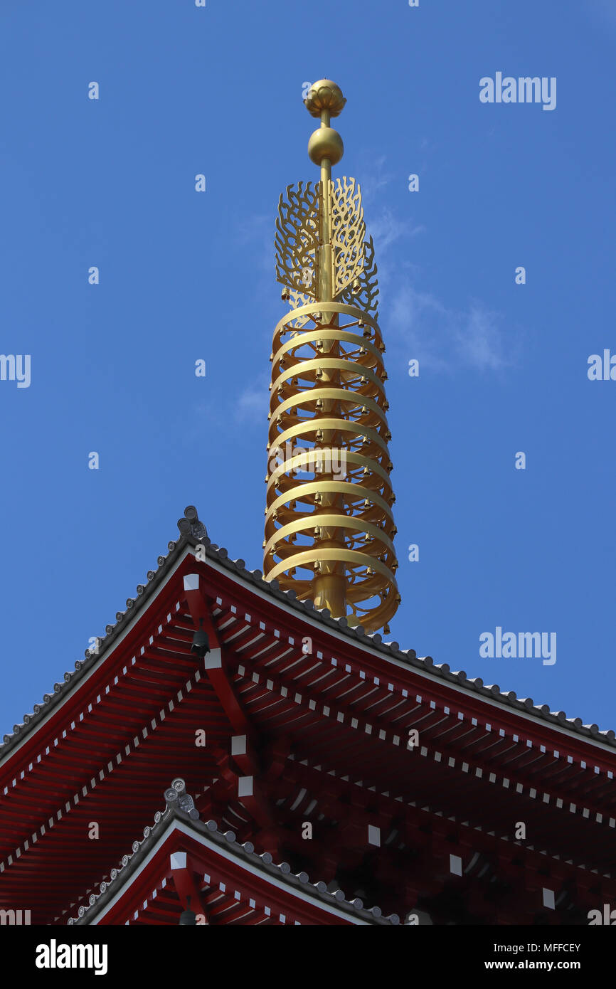 The golden finial on top of the pagoda at the Sensoji Temple in Tokyo, Japan is called a sorin, and functions as a lightning rod. It has 8 sections. Stock Photo