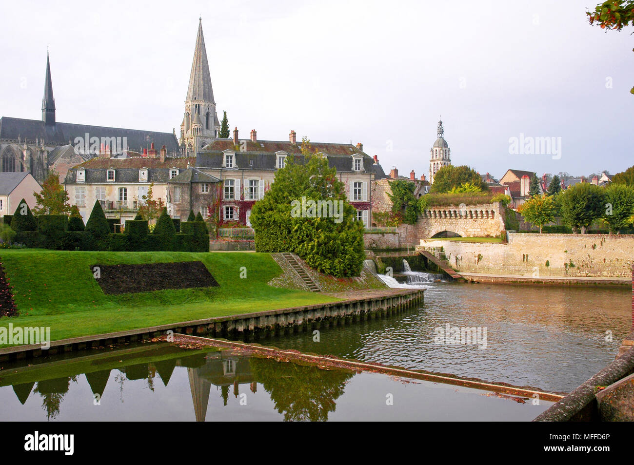 The River Loir at Vendome.  Spire of L'Abbaye de la Trinite, and the watergate. Stock Photo