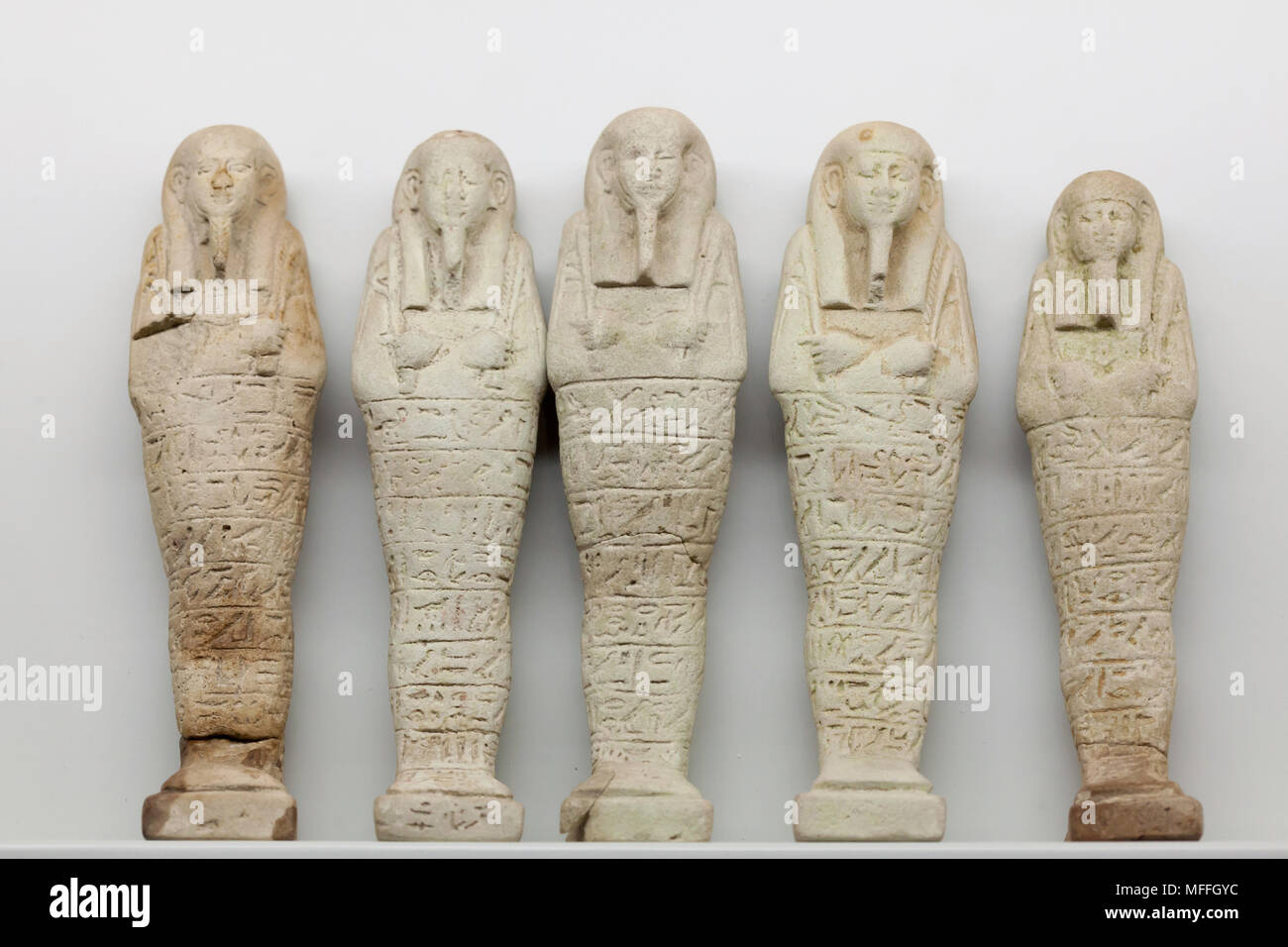 Ancient Egyptian ushabtis (funerary statuettes) of Herudja, son of Paunhatef, dated from the 26th Dynasty (664-525 BC) on display in the National Archaeological Museum (Museo Archeologico Nazionale di Napoli) in Naples, Campania, Italy. Stock Photo