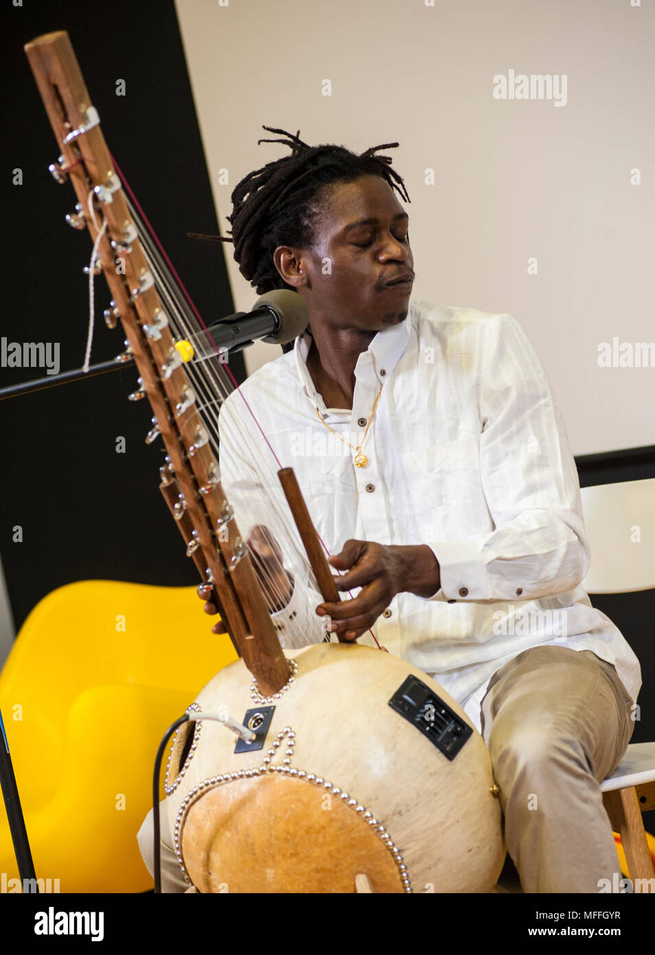 West African music performed by Jali Buba Kyateh from The Gambia and Mamadou Diouf from Senegal in a small exhibition hall down town Warsaw, Poland. Stock Photo