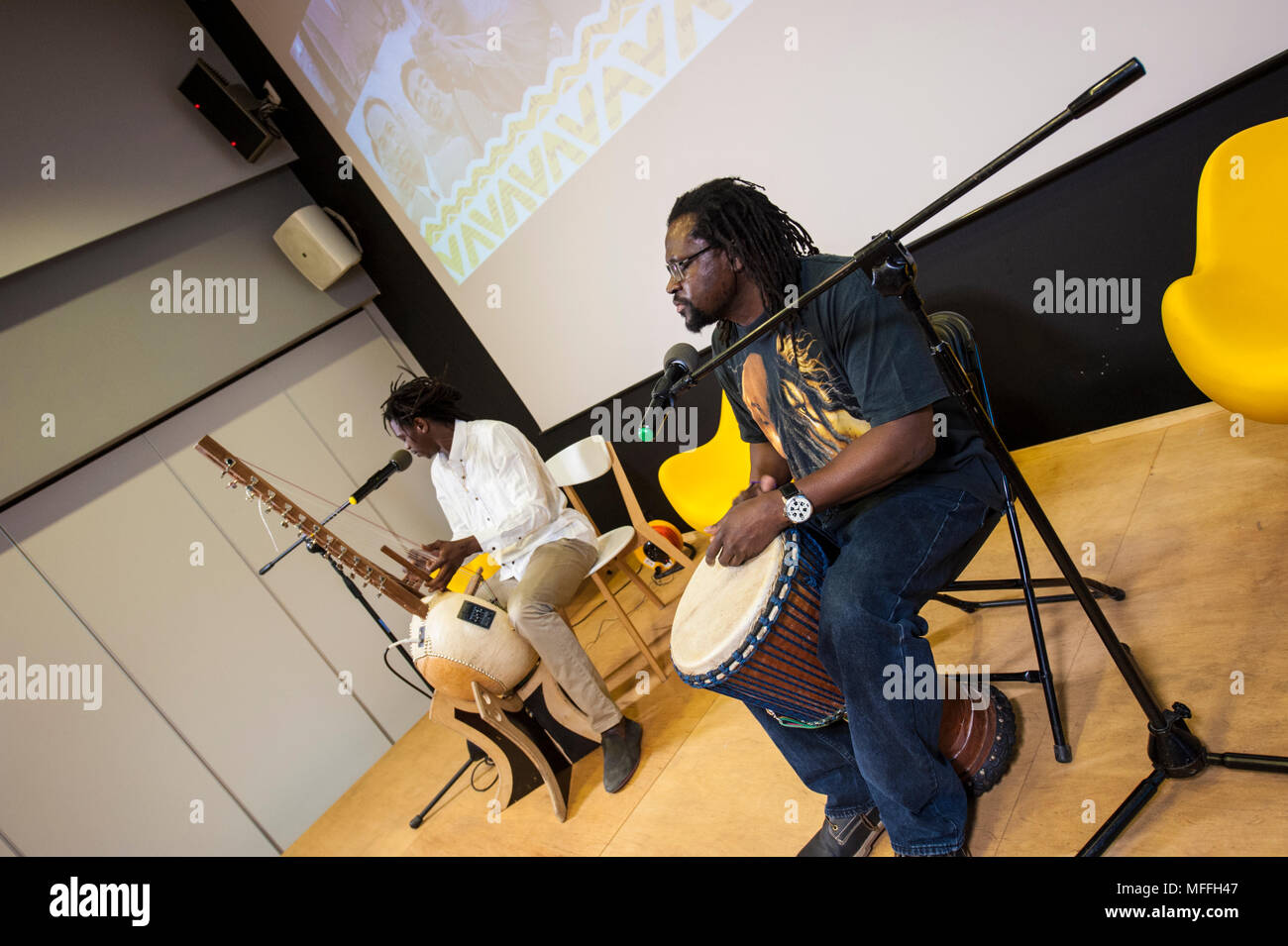 West African music performed by Jali Buba Kyateh from The Gambia and Mamadou Diouf from Senegal in a small exhibition hall down town Warsaw, Poland. Stock Photo