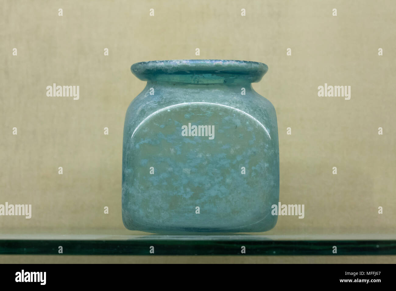 Roman glass vessel used to contain medicines, sauces or special foods found in Pompeii on display in the National Archaeological Museum (Museo Archeologico Nazionale di Napoli) in Naples, Campania, Italy. Stock Photo