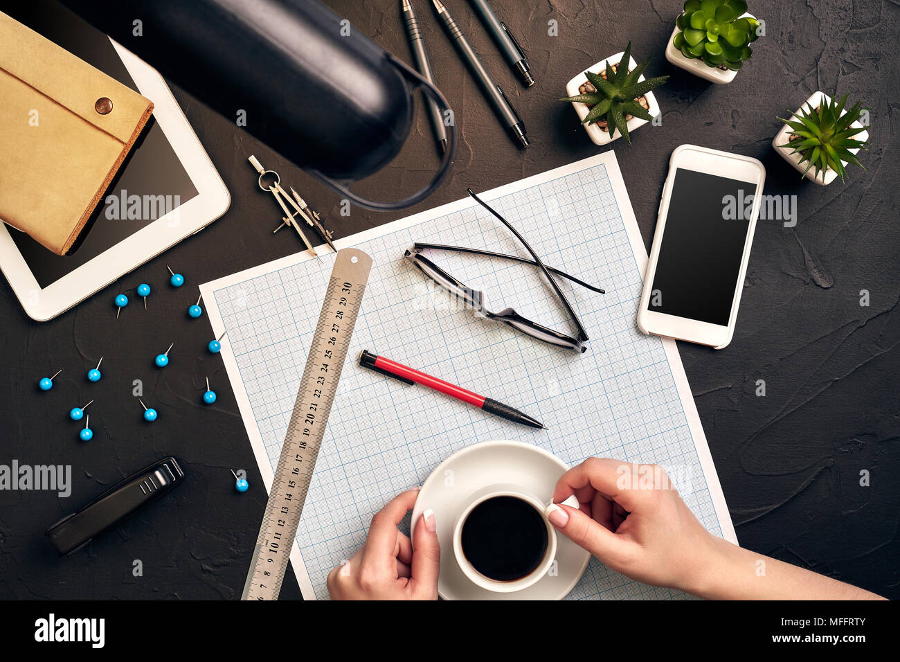 Architect working on blueprint. Architects workplace - architectural project, blueprints, tablet pc. Engineering tools. Top view Stock Photo