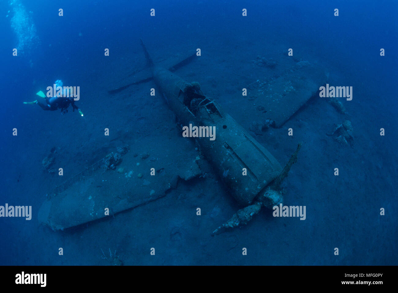 Scuba diver and wreck of airplane Zero A6M2b-Model 21, n¡8224, Gabuna Sulphur area, Walindi, Kimbe Bay, West New Britain, Papua New Guinea, Pacific Oc Stock Photo