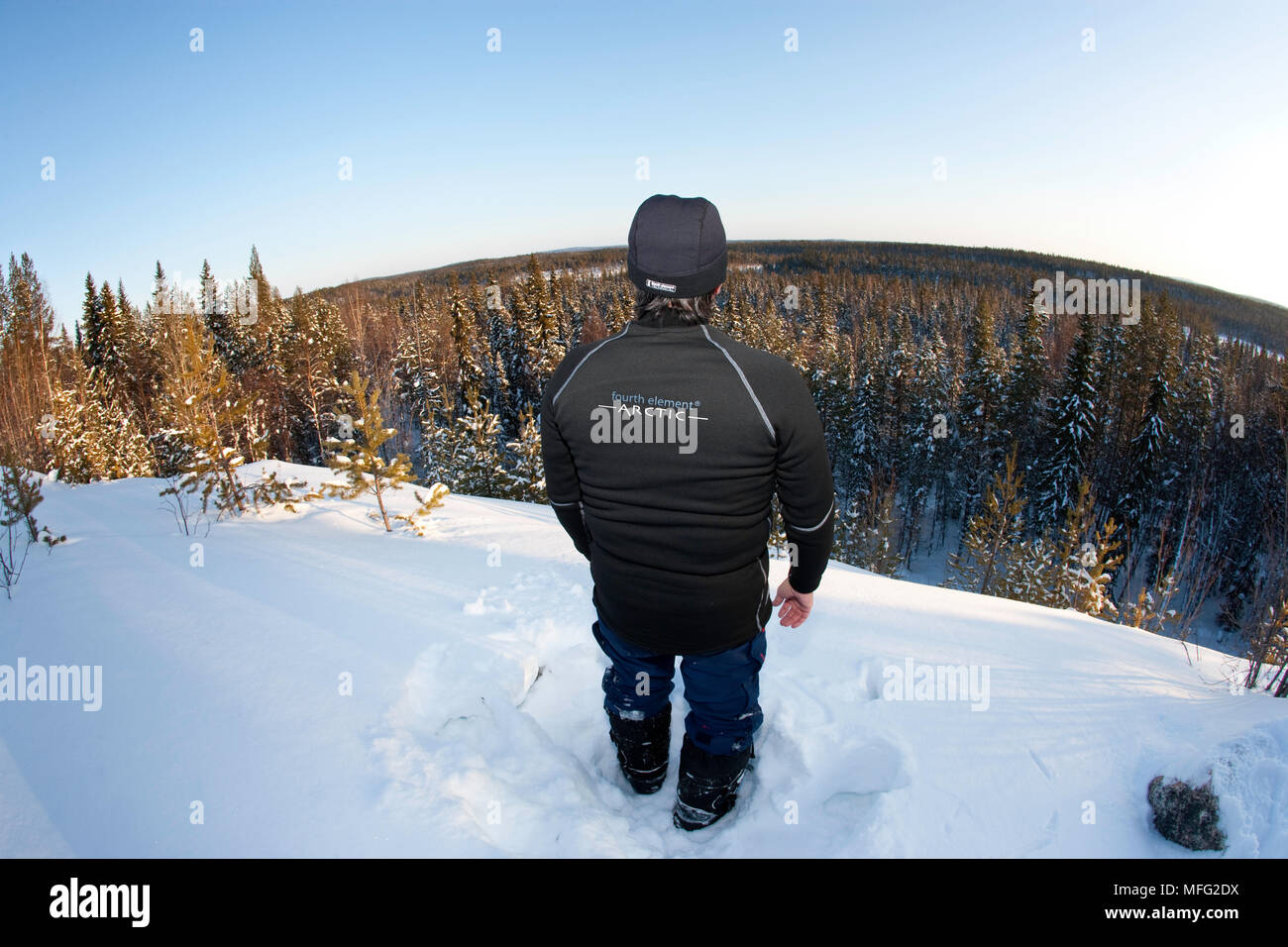 Franco watching the panorama of the forest, Arctic circle Dive Center, White Sea, Karelia, northern Russia Stock Photo