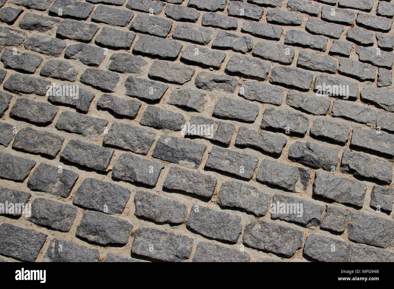 Сobblestone pavement pattern texture background image. Stock Photo