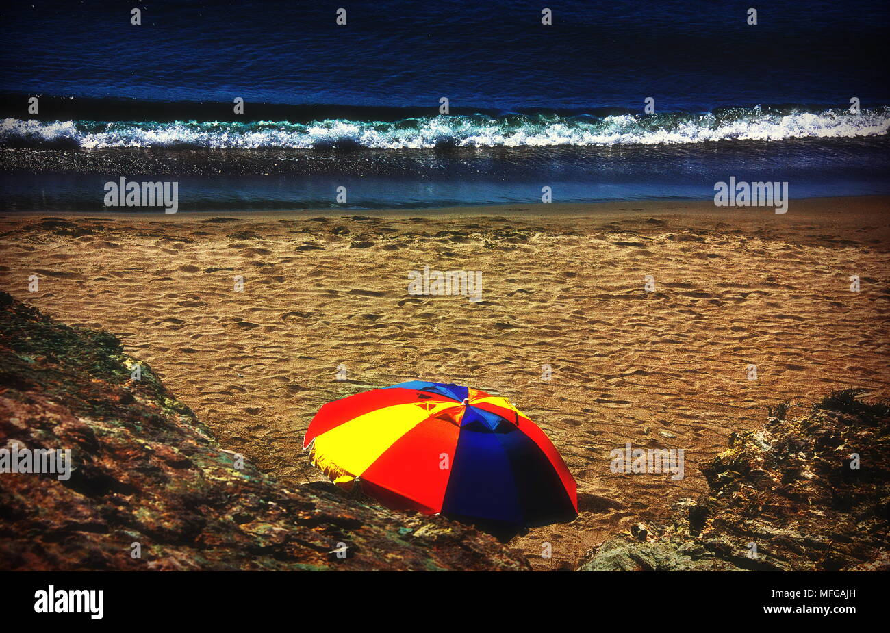 Colorful beach umbrella on a sandy beach, Andros Greece Stock Photo Alamy