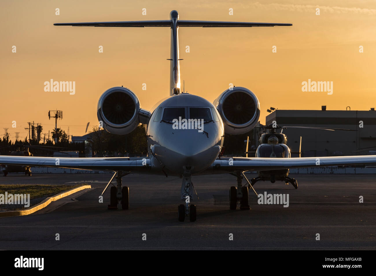 After sunset view of small jet airplane. Stock Photo