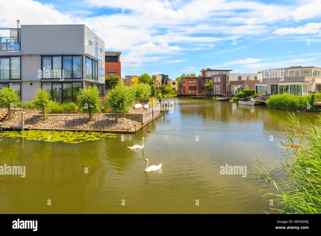 Villas and houses located at the water on a sunny Summer day. Located