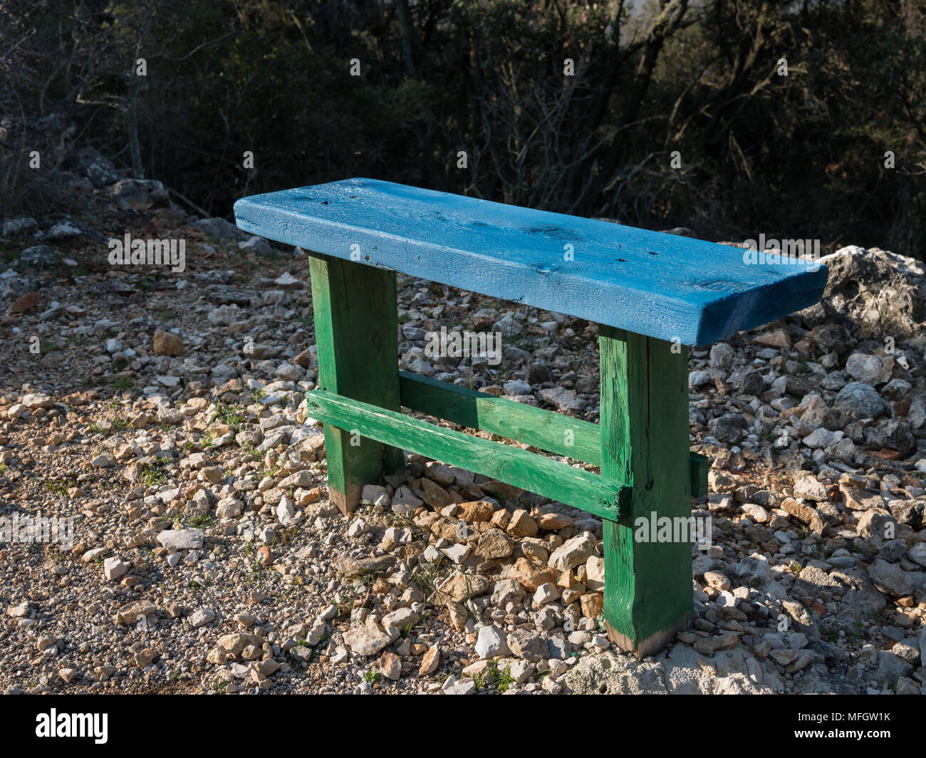 Small blue green bench made of wood in the forest Stock Photo - Alamy
