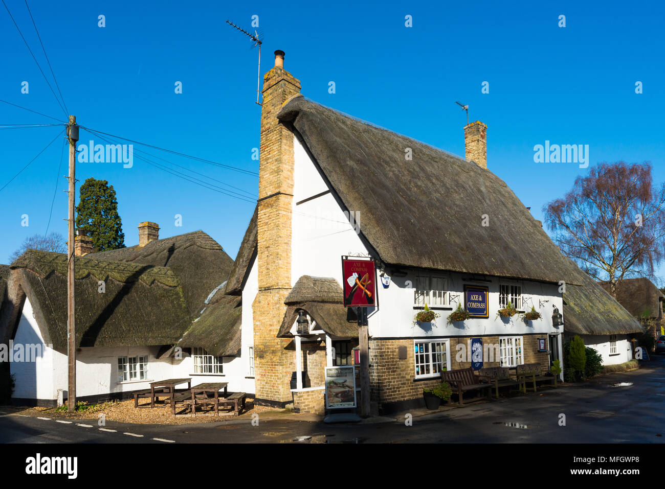Traditional village pub Axe and Compass with thatched roof at Hemingford Abbots, Cambridgeshire
