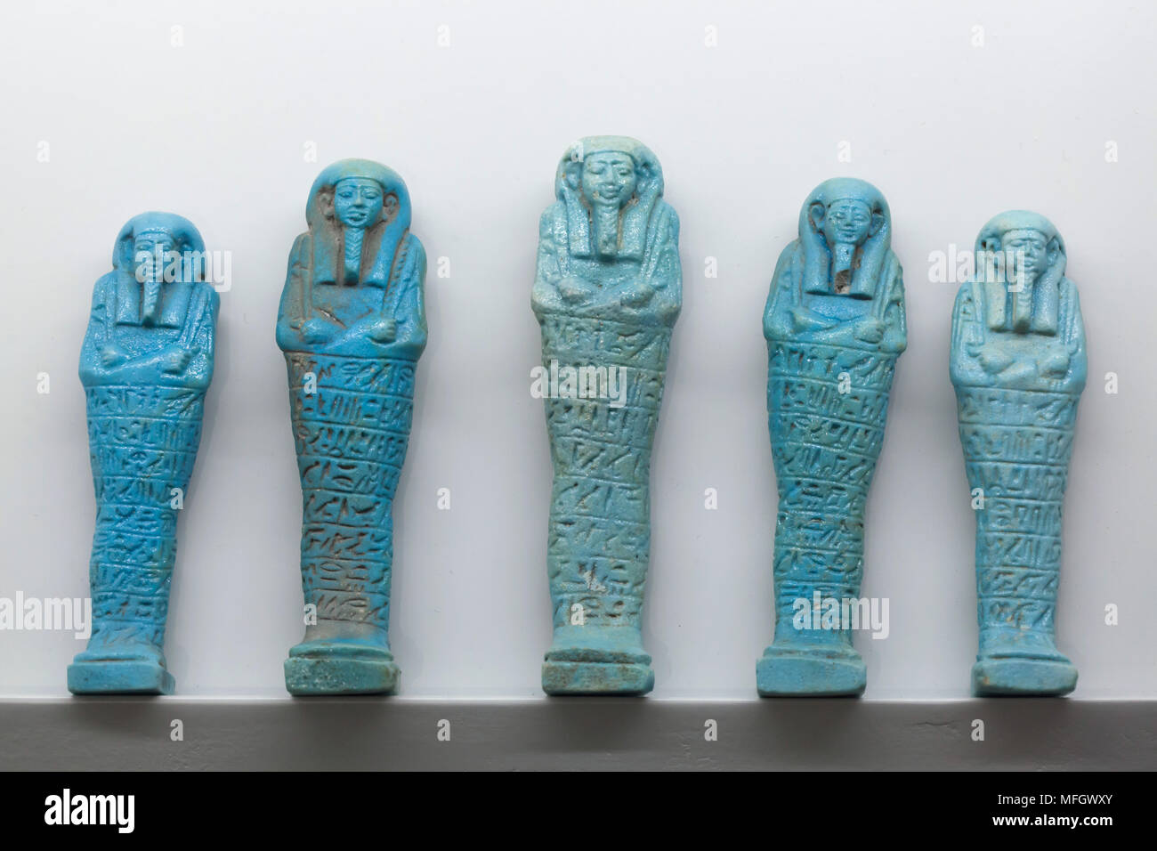 Ancient Egyptian ushabtis (funerary statuettes) dated from the late period of the 26th Dynasty (664-525 BC) on display in the National Archaeological Museum (Museo Archeologico Nazionale di Napoli) in Naples, Campania, Italy. Stock Photo