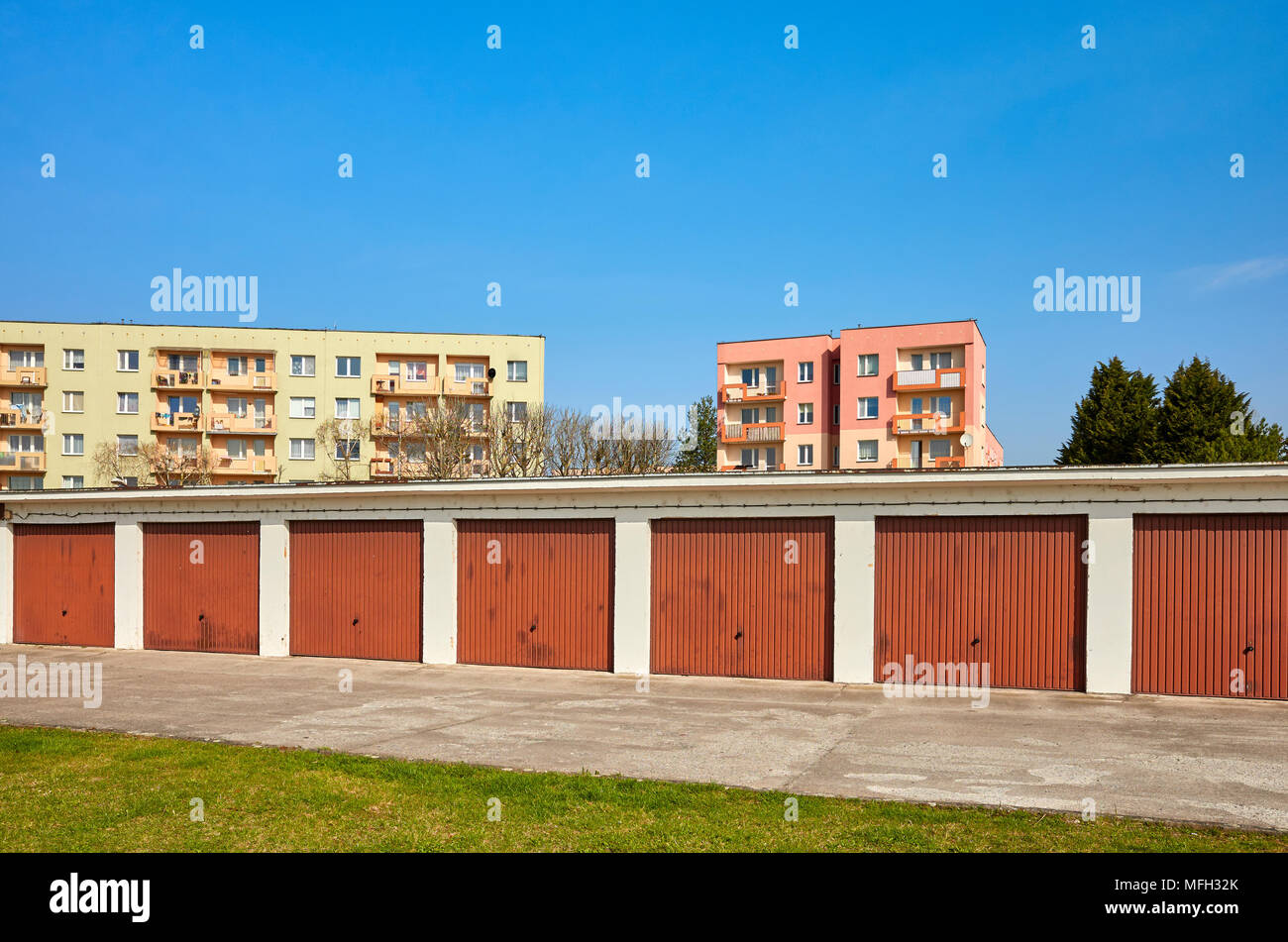 Row of garages with closed gates in a residential neighborhood, Szczecin, Poland. Stock Photo