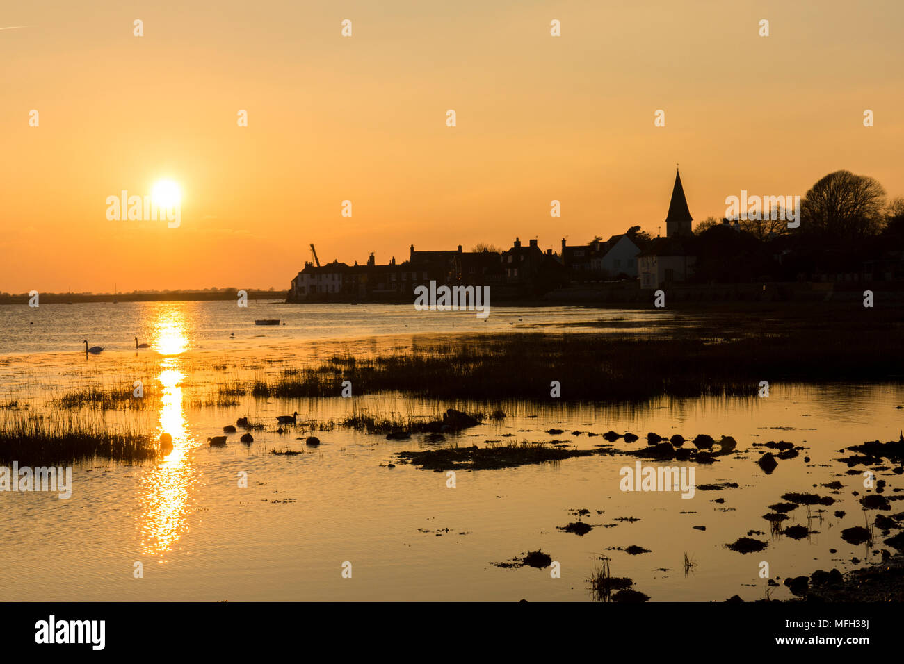 Bosham, Bosham Harbour, Sunset, sundown, reflected in sea, tide in. Sussex, UK. , village, church, February Stock Photo