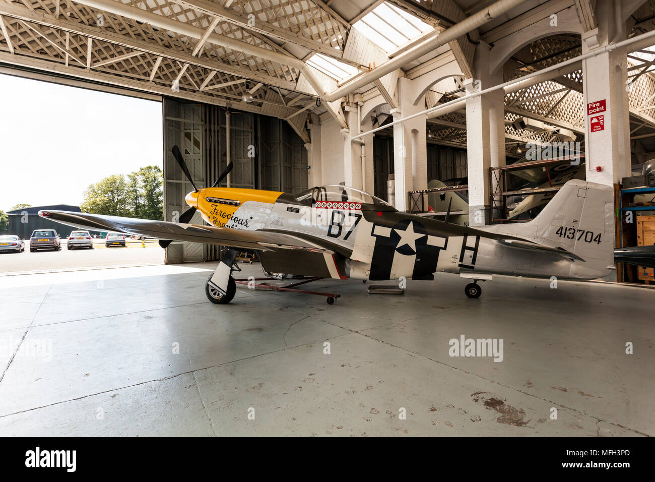 Duxford Air Museum. England, UK.  A P-51D Mustang on display in an aircraft hanger. Stock Photo