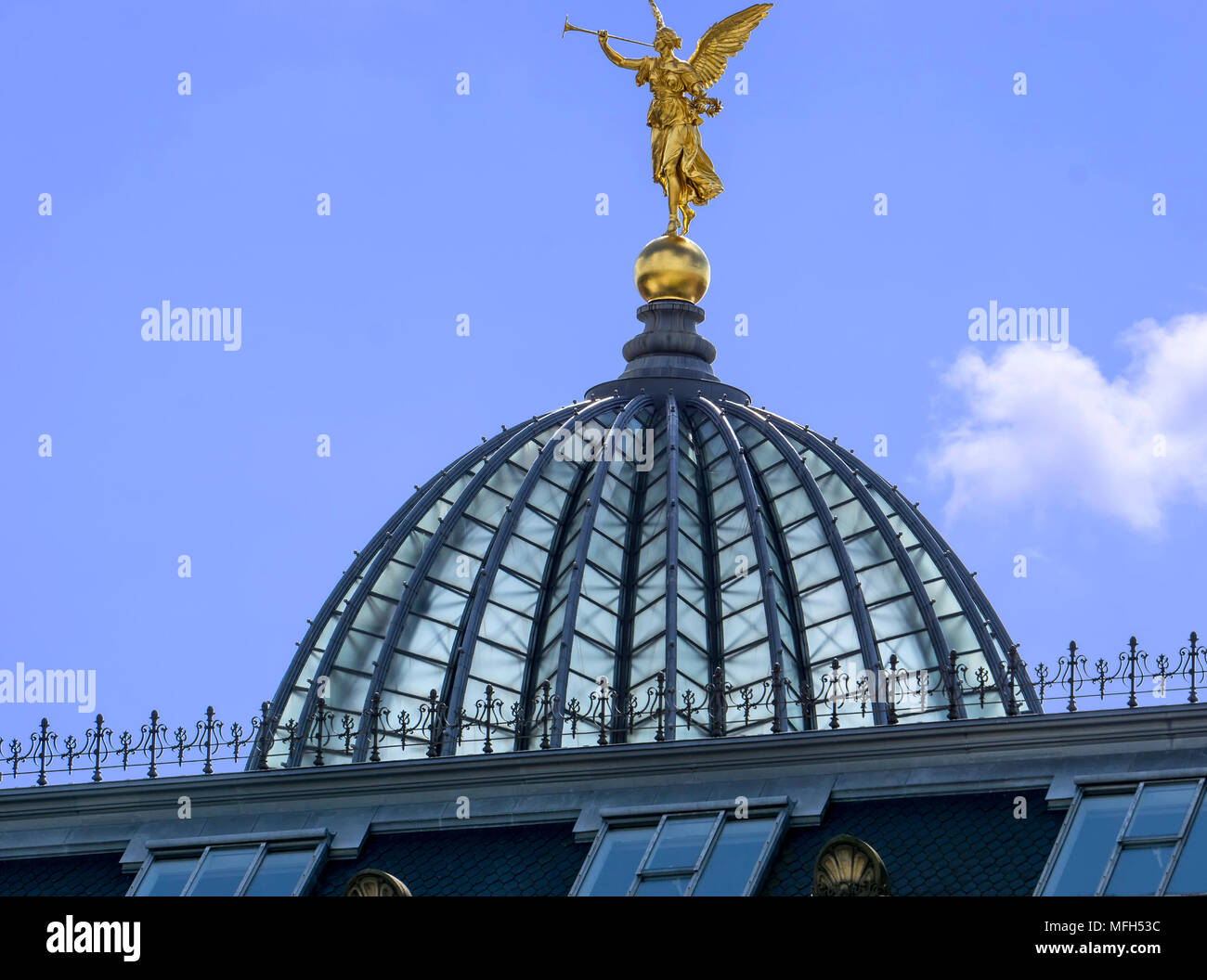 Glass Dome of the Dresden Academy of Fine Arts referred to as the 'Lemon Squeezer' is topped with a golden angel statue. Stock Photo