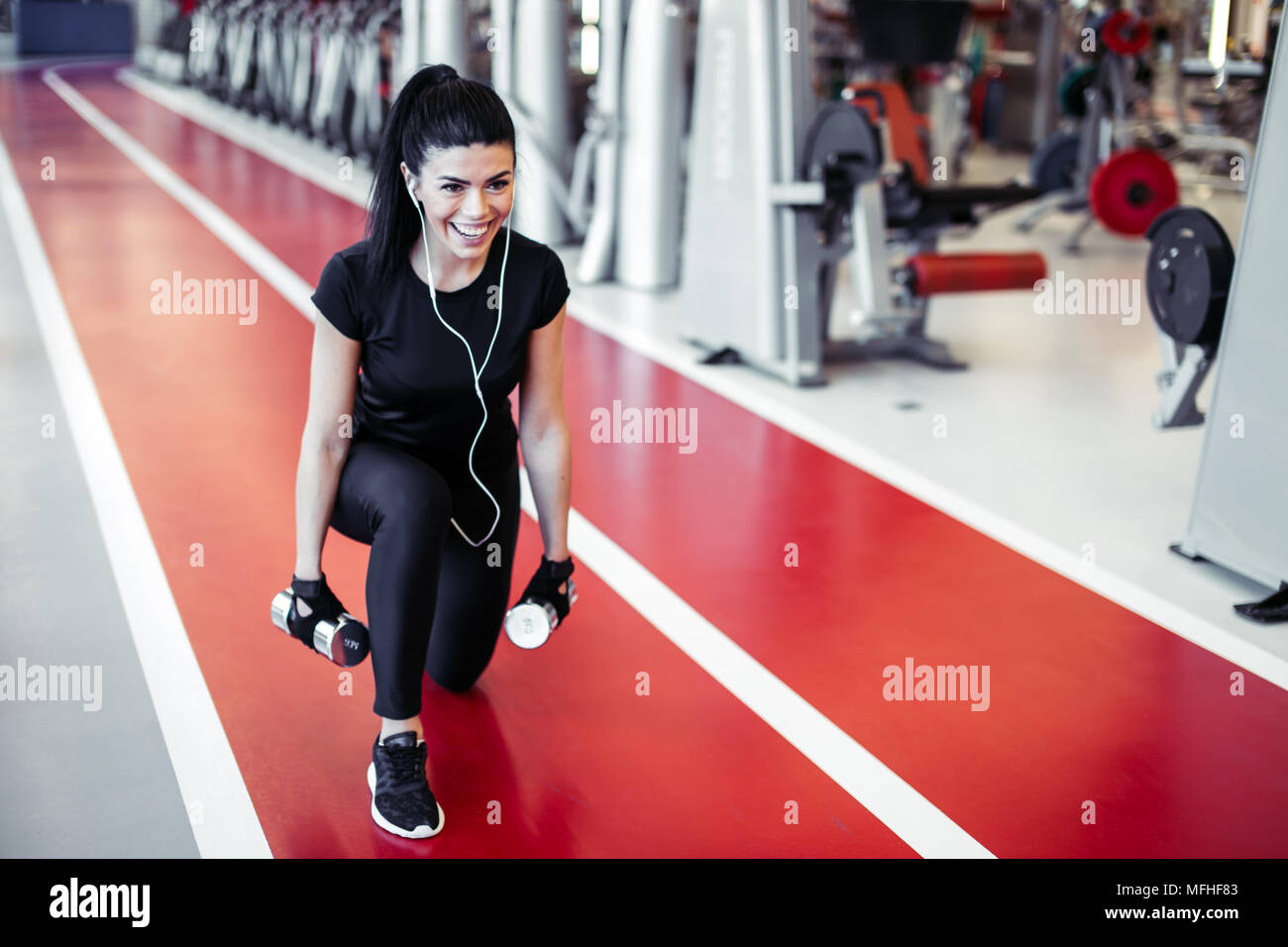 dumbbell lunge woman workout exercise at gym one leg split squats Stock Photo Alamy