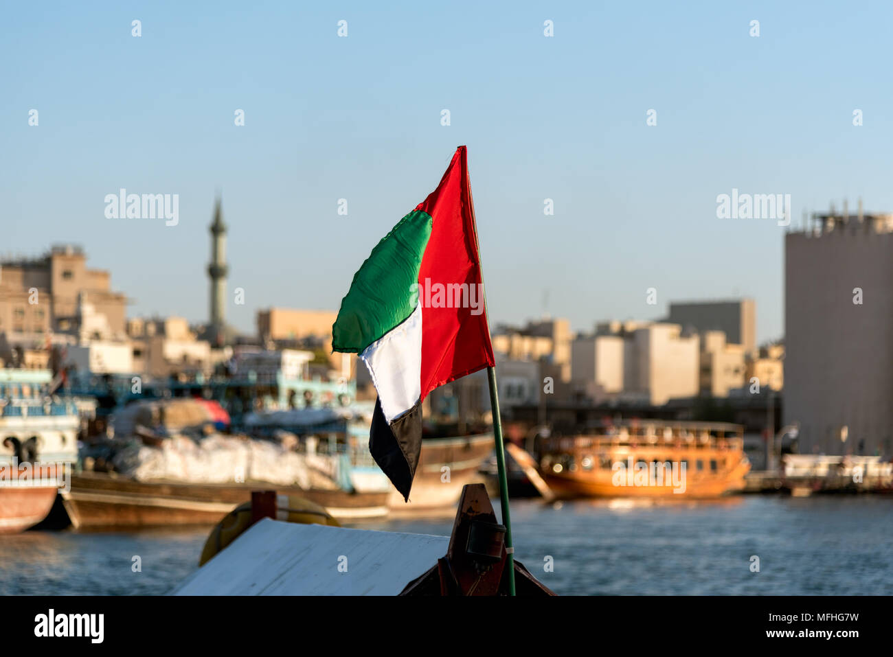 Dubai Creek with traditional boats and piers. Stock Photo