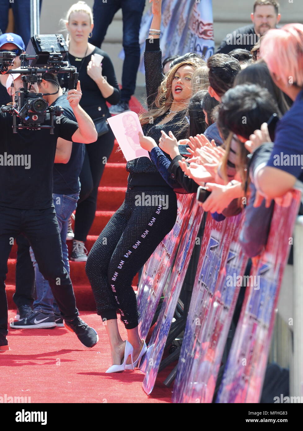 Heidi Klum hits the red carpet in a red tight dress for "Americas Got ...