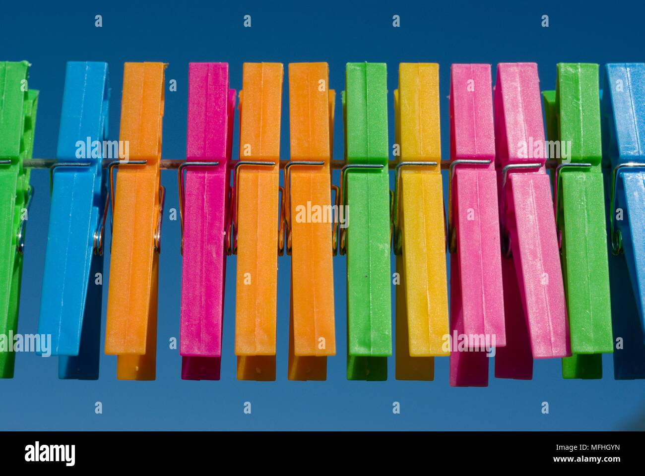 Multi coloured pegs Stock Photo Alamy