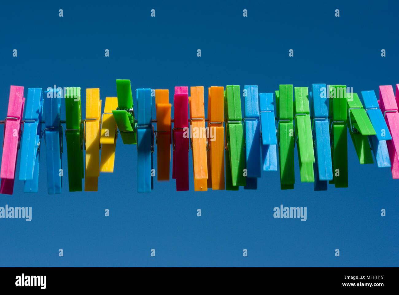 Multi coloured pegs Stock Photo Alamy