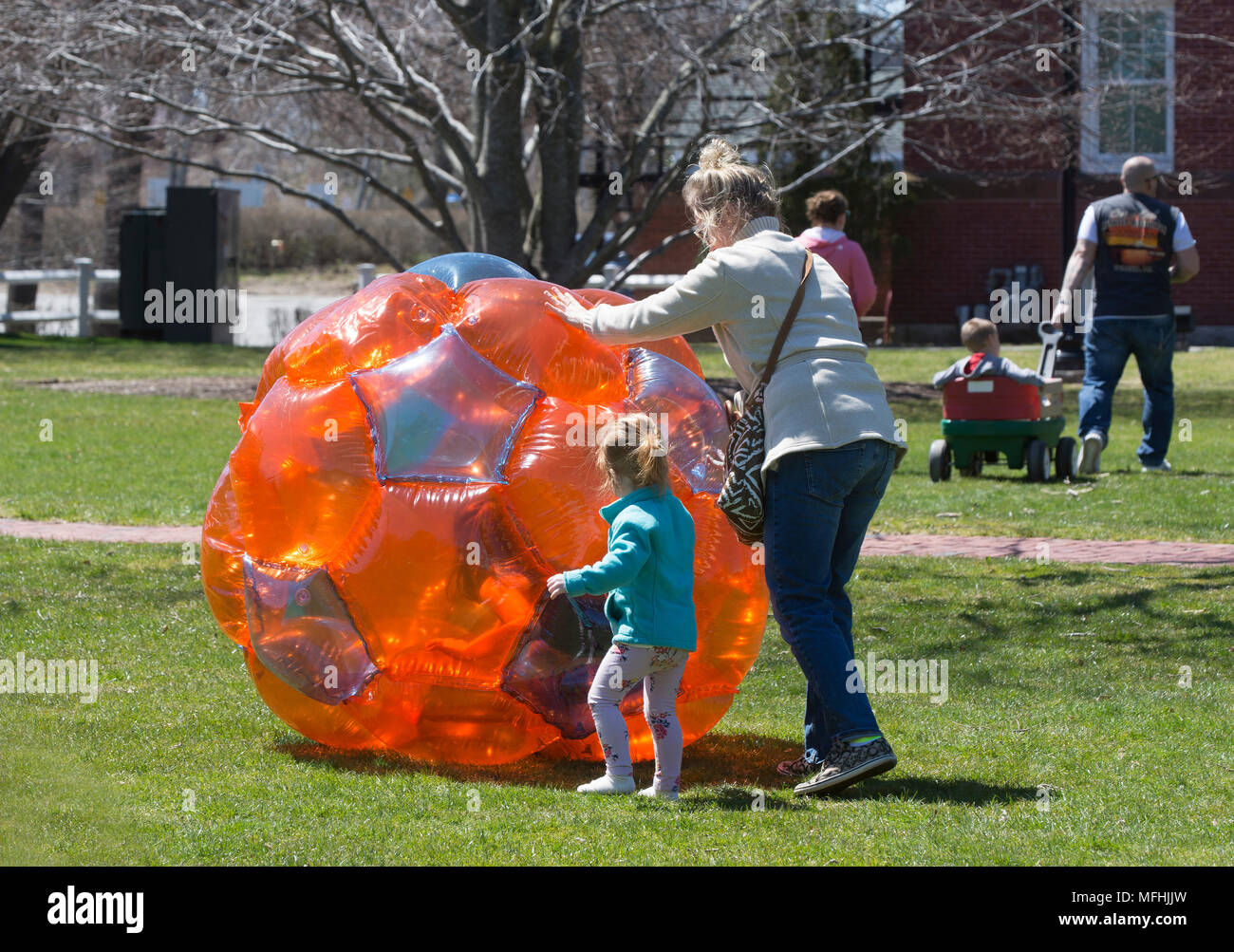 Family fun in a bubble during an Open Streets Festival in Hyannis, Massachusetts of Cape Cod, USA Stock Photo