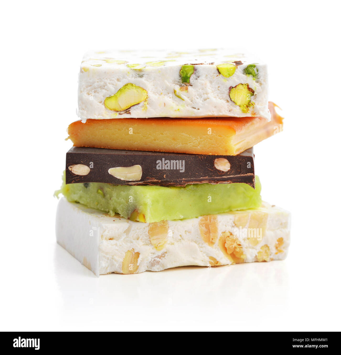 Turron Types Pile of different turron isolated on white background with clipping ...
