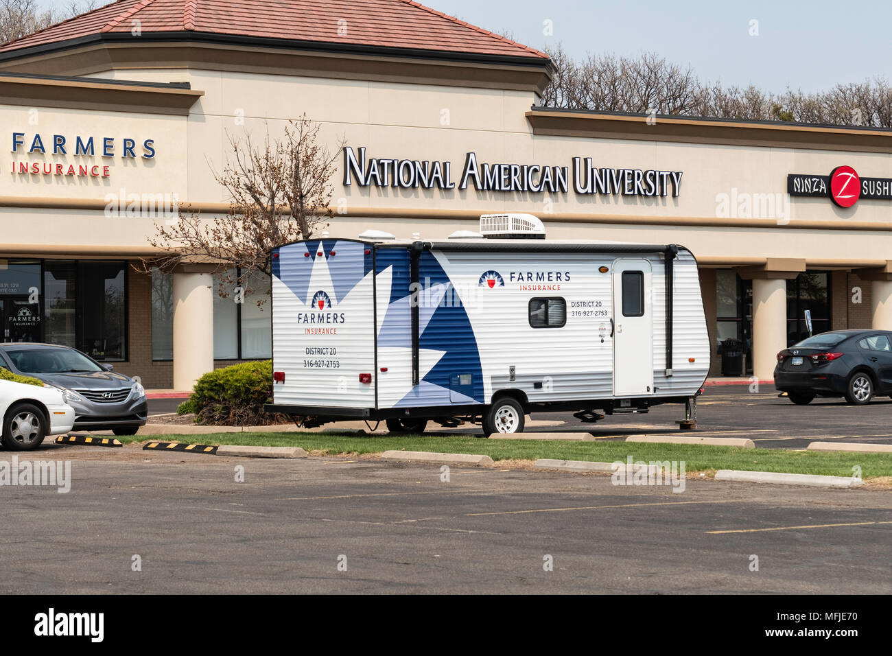 Farmers Insurance Casualty trailer parked outside the business. Wichita, Kansas, USA.. Stock Photo