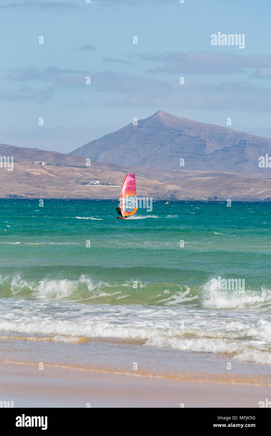 Wind-surfer off Playa de La Barca, Costa Calma, on the volcanic island of Fuerteventura, Canary Islands, Spain, Atlantic, Europe Stock Photo