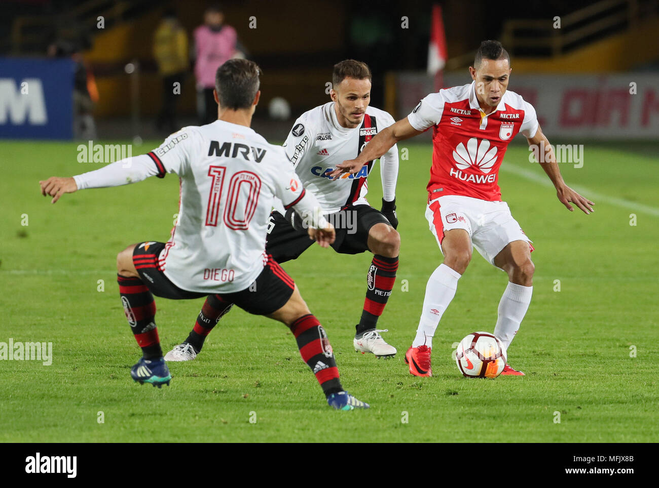 Independiente Santa Fe S Armando Vargas R Vies For The Ball With Flamengo S Rene C And Diego L During The Copa Libertadores Soccer Match Between Independiente Santa Fe Of Colombia And Flamengo Of