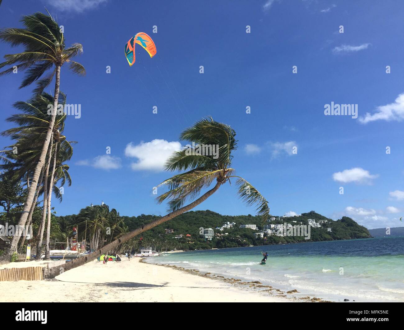 24 April 2018, Philippines, Boracay Island: A kite surfer on Bulabog beach. A few weeks ago the island was still a dream goal. For some, the island was the most beautiful in the world. That is until the president of the Philippines called it a cesspit. At least the island is fully booked for the next six months. Photo: Girlie Linao/dpa Stock Photo